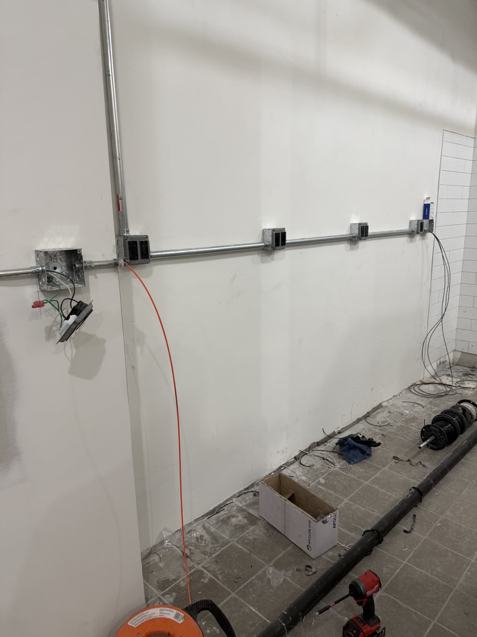 NYC duplex conversion conduit branch run with electrical box placement for kitchen upgrades.